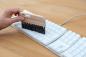 Preview: PC-Bürste aus Buchenholz mit dunklem Besatz reinigt Tastatur